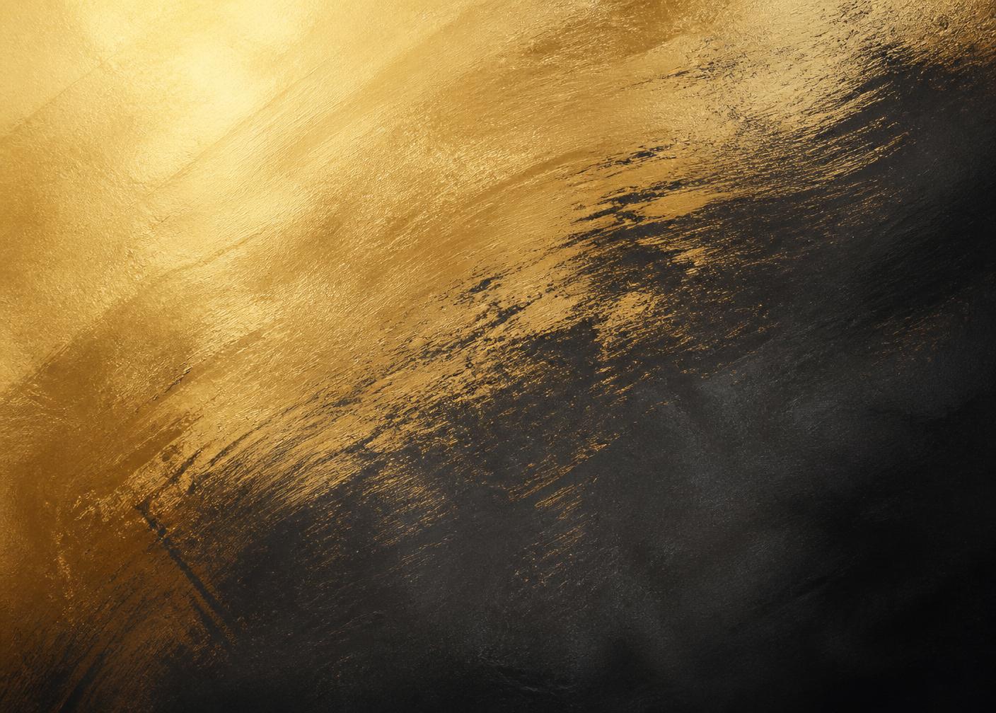 Abstract brushed gold surface fading into charcoal